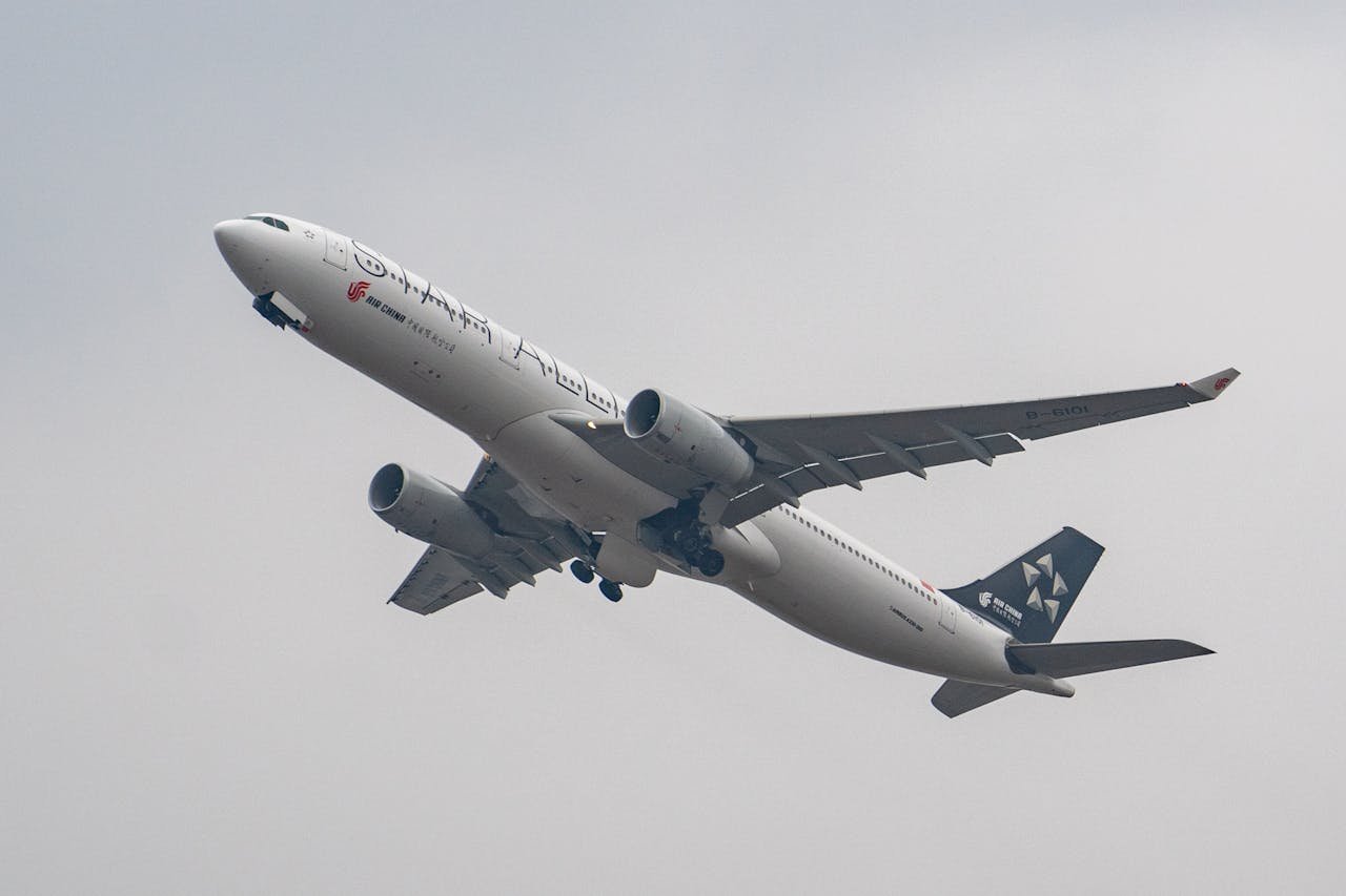 An Airbus A330 aircraft soaring into the sky during takeoff, displaying a sleek design.